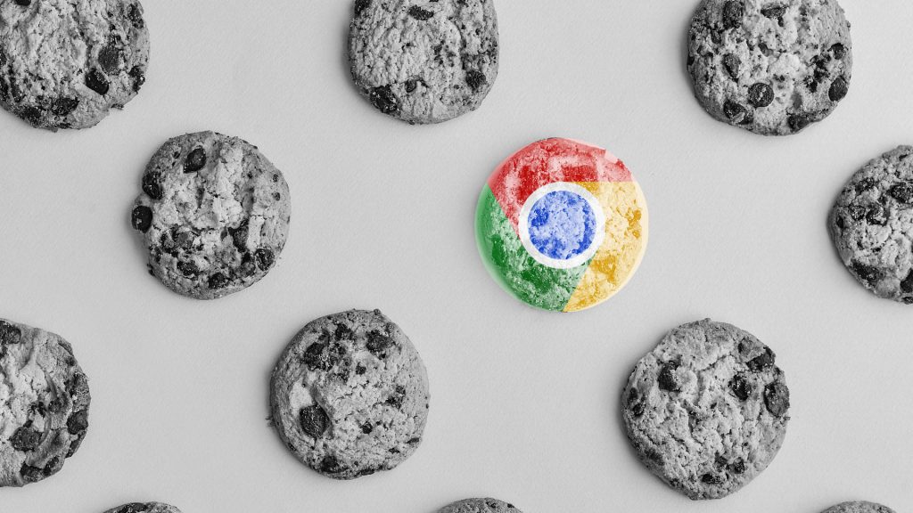 Chocolate chip cookies on a white background greyscale with the Google Chrome Logo over the cookies.