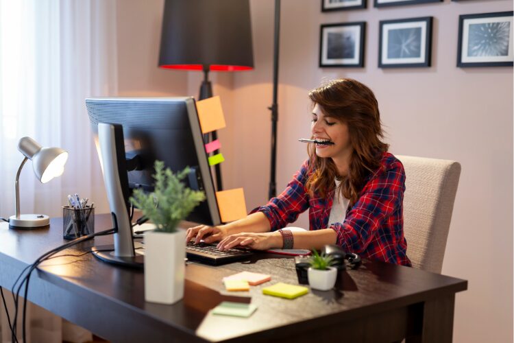 Women writing engaging content for copy at a desk.