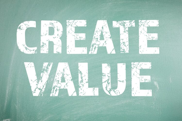 the words create value on a chalkboard